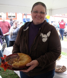 Theresa Matthews with all that was left of her winning 2014 Great New England Apple Pie Contest pie after the judging. (Russell Steven Powell photo)