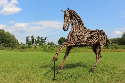 "Feed Me Apples," driftwood sculpture by Lindsey Molyneux, 2015 "Art in the Orchard," Park Hill Orchard, Easthampton, Massachusetts. (Russell Steven Powell photo)