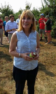 New Hampshire Gov. Maggie Hassan enjoys an apple at Mack's Apples in Londonderry, where she read her proclamation officially recognizing September as New England Apple Month. (Bar Lois Weeks photo)